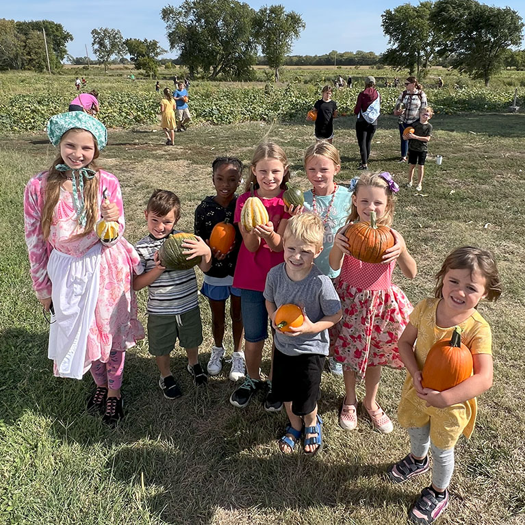 Young students love playing in Carroll's Corn Crib at The Walters' Farm Pumpkin Patch and Corn Maze near Wichita, Kansas.  School tours and field trips are the perfect blend of farm education and fun outing